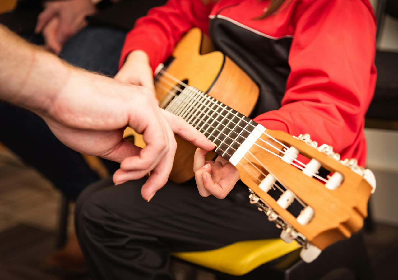 Ryan Henry as educator teaching music